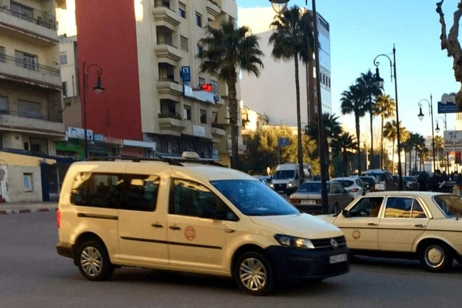 Private taxi transfer from Tangier Airport to city center with luggage and tourists